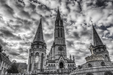 Sanctuary of Our Lady of Lourdes against the sky. France. Black and white photo