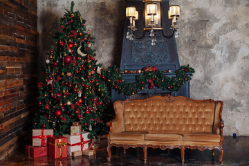 Christmas and New Year decorated interior room with presents and New year tree.Classic red and gold decor