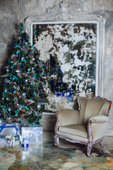 Christmas and New Year decorated interior room with presents and New year tree.Silver and blue Xmas tree