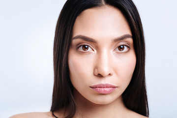 Obraz premium Close up of attractive young brunette with loose hair