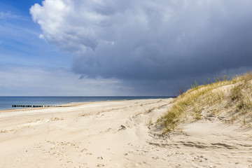 Sand dune on a Baltic Sea beach in Dziwnow town, Poland