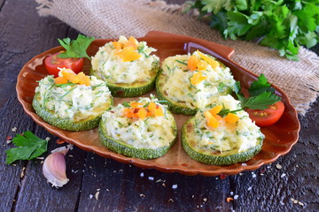 Grilled zucchini with cheese and garlic topping