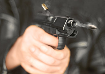 man with hand gun pistol rubber attack violence with flying bullet