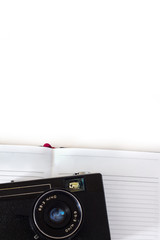 Vintage old 35mm cameras, lenses and light meter on white background .