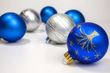 blue and white christmas baubles with gold and silver glitter