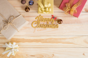 vintage Christmas wood background with gifts and copy space.