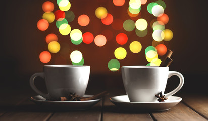 two cups of coffee on a wooden table