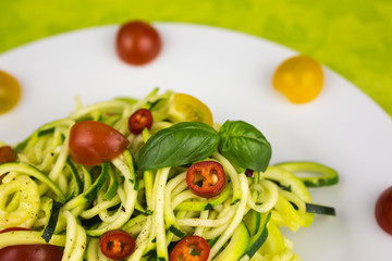 vegetarian zucchini noodles with cherry tomatoes and pepper