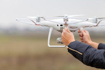 The drone and photographer woman hands