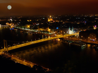 Fototapeta na wymiar view of Budapest from Gellert's mountain at night with a glowing moon