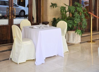 Outdoor tables for breakfast of a hotel.