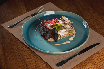grilled pork ribs on dark plate