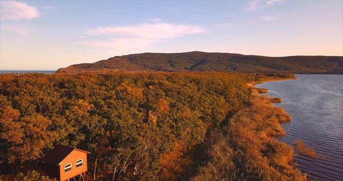 Descending aerial view of the birdman house near lake Blagodatnoye at the Sikhote-Alin Nature Reserve in Russian Far East. It has been inscribed on the UNESCO World Heritage List since 2001.