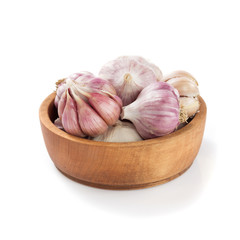 garlic in bowl isolated on white