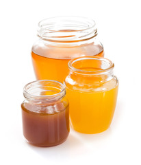 variety of honey in jar white background