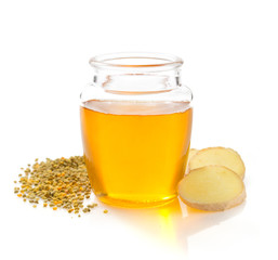 jar of honey on white background