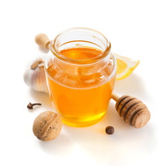 jar of honey on white background