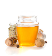 jar of honey on white background