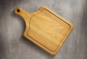 cutting board at grey stone table
