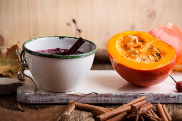 Homemade cranberry sauce in rustic mug, preparation Thanksgiving dinner