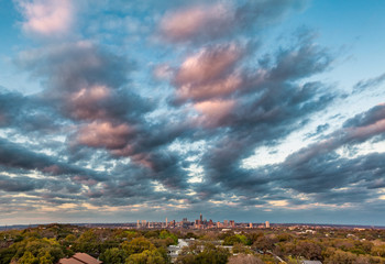 Sunset clouds descend upon the skyline over Austin, Texas