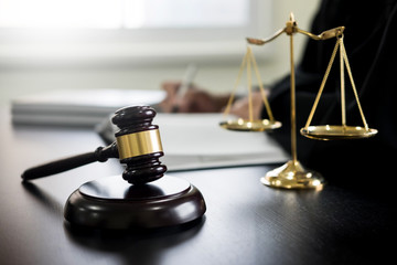 gavel and soundblock of justice law and lawyer working on wooden desk background.