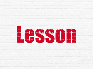 Learning concept: Painted red text Lesson on White Brick wall background