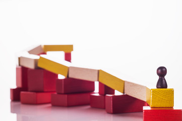 Abstract man on top of a wooden construction, the concept of a career competition, career ladder, business learning success, business hierarchy. Achieving success. Social status, business metaphor.