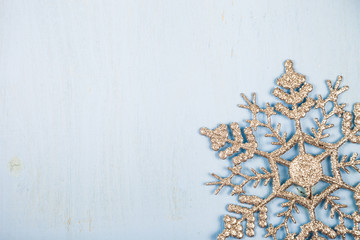 Silvery snowflakes on a wooden background.