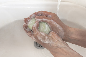 Fototapeta premium Washing of hands with soap under running water. Cleaning Hands.