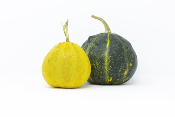 Still life yellow and green pumpkins isolated on white background