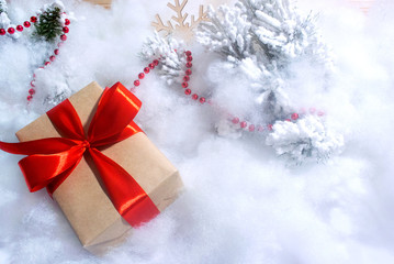 Gift box with red bow on white