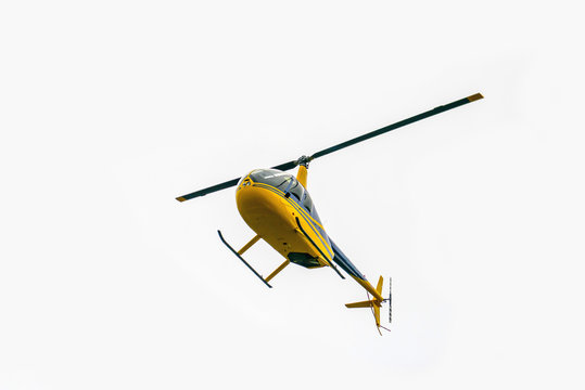 Yellow helicopter takes off. Air transport in the sky. Aircraft emergency help. The Golden Ring Helicopter Tour 