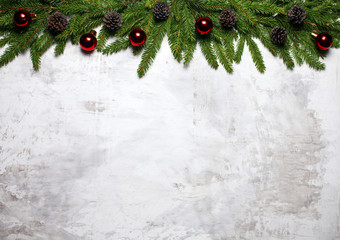 Christmas white background with fir branches and fir cones. Christmas wallpaper. Flat lay, top view