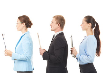Portrait of three office workers standing one after another on white background