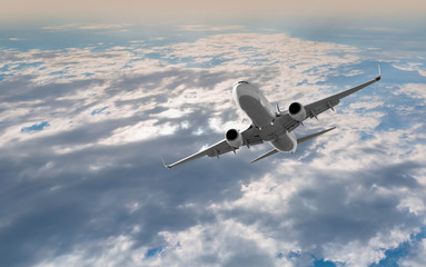 Fototapeta premium Passenger airplane in the clouds. travel by air transport