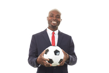 Portrait of African businessman holding soccer ball on white background