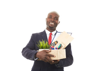 Portrait of African office worker holding box with personal belongings