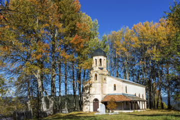 Fototapeta premium Autumn landscape with church located in village Gela, in the hearth of Rodopi Mountain, Bulgaria.