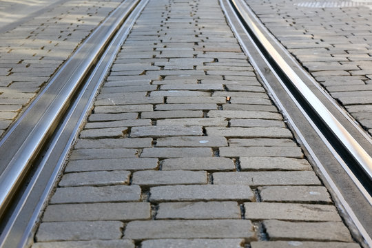 Tram rails on cobbled road surface
