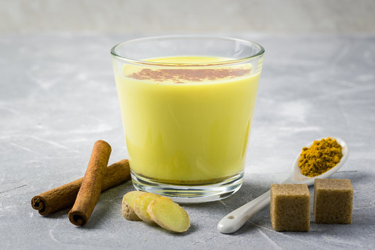 Healing Turmeric Chai Latte On Stone Background. Selective Focus, Space For Text. 