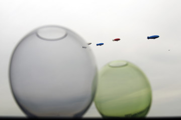 Zeppelins flying in the sky as if they came out of the glass bowl © CoolimagesCo