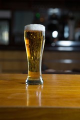 Close-up of beer glass on the counter