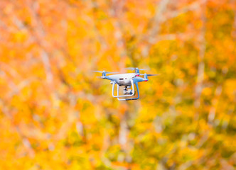 drone quad copter with digital camera on the sky