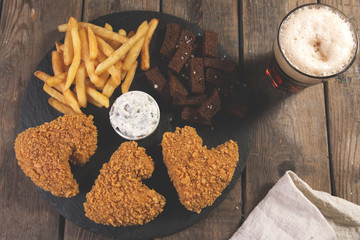 fried chicken wings breaded crispy with french fries fried rye bread croutons beer snack