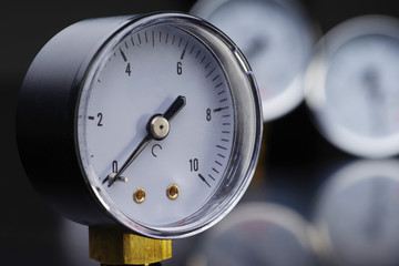 Manometer in close-up. A pressure gauge on the background of other instruments. 
