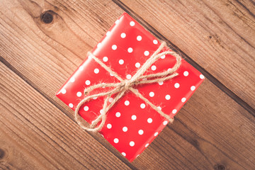 Gift on wooden table. Christmas background. top view
