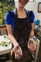 Woman holding charcoal pencil