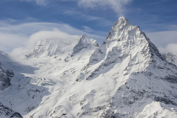Winter mountains and peaks on a clear day.