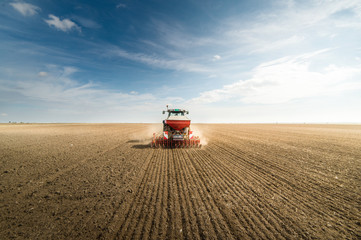 Tractor plowing fields -preparing land for sowing in autumn